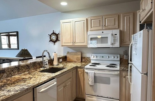 Ocracoke Villa | Second-floor two-bedroom villa with screened porch.