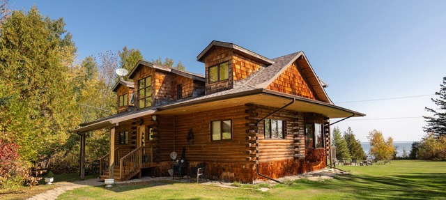 Authentic & Stunning, Rustic Log House located on 28 acres with private road in Traverse Bay