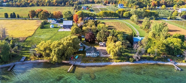 Private Waterfront Retreat! Sunny Lakehouse + 4 Cottages & 10 King Beds in Prince Edward