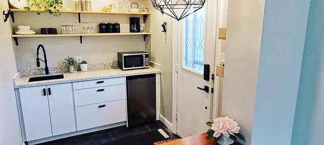 Stylish Main Level Suite with Separate Entrance, Private Patio and 2 Car Parking in Aurora