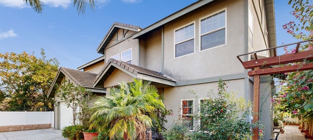 Centrally located home with private patio, updated interior, fireplaces, & W/D in Anaheim